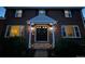 Beautiful front door area showing double doors, lighting and greenery with a welcoming presence at 6953 S Prescott St, Littleton, CO 80120