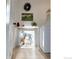 Bright laundry room featuring modern white washer and dryer, and playful decorative accents at 6953 S Prescott St, Littleton, CO 80120