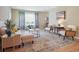 Inviting living room with a comfortable seating area and a decorative rug at 6953 S Prescott St, Littleton, CO 80120