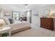 Serene main bedroom with neutral tones, plush carpeting, and stylish decor for a calming retreat at 6953 S Prescott St, Littleton, CO 80120