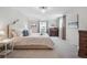 Bright main bedroom with neutral tones, plush carpeting, and stylish decor for a calming retreat at 6953 S Prescott St, Littleton, CO 80120