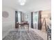Well lit office features neutral colors, a large rug, a desk, and bright windows at 6953 S Prescott St, Littleton, CO 80120