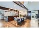 Dining room with hardwood floors, wood beam features, and a stylish dining table with seating at 643 Aspen Rd, Golden, CO 80401