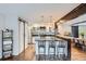 Modern kitchen featuring stainless steel appliances, a breakfast bar, and sliding barn doors at 643 Aspen Rd, Golden, CO 80401