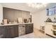 Stylish bar area featuring a mini fridge and ample counter space for entertaining at 9309 Highland Pl, Arvada, CO 80002