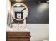 Bathroom featuring a modern vanity with round mirror and stylish fixtures at 9309 Highland Pl, Arvada, CO 80002