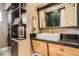 Modern bathroom vanity and mirror in this remodeled bathroom design with open shelving at 9309 Highland Pl, Arvada, CO 80002