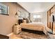 Bedroom with neutral walls, wood floors, carpet and hanging pendant lights at 9309 Highland Pl, Arvada, CO 80002