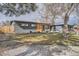 Charming single-story home with a well-maintained lawn, modern design, and attached garage at 9309 Highland Pl, Arvada, CO 80002