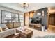 Well-designed living room with a sleek entertainment center and comfortable seating area at 9309 Highland Pl, Arvada, CO 80002