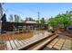 Outdoor deck featuring stylish seating, a dark-stained fence, and stone pavers to add to the backyard's charm at 1602 Garfield St, Denver, CO 80206