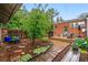 Serene backyard with lush greenery, deck, and charming landscaping at 1602 Garfield St, Denver, CO 80206