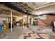 Unfinished basement with exposed pipes, storage, and concrete floor at 1602 Garfield St, Denver, CO 80206