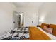 Bedroom features hardwood floors, bright natural light, neutral colors, and access to hallway at 1602 Garfield St, Denver, CO 80206