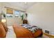 Bedroom featuring hardwood floors, bright natural light, neutral colors, and calming decor at 1602 Garfield St, Denver, CO 80206