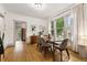 Charming dining room features hardwood floors and a window with a view of the outdoors at 1602 Garfield St, Denver, CO 80206