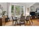 Inviting dining room features hardwood floors, a large window, and comfortable seating at 1602 Garfield St, Denver, CO 80206