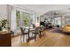 Bright dining room with hardwood floors and large windows at 1602 Garfield St, Denver, CO 80206