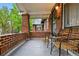 Inviting covered front porch with seating area, perfect for relaxing at 1602 Garfield St, Denver, CO 80206