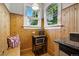 Quaint kitchen nook boasts wood paneling, bright windows, and a cozy atmosphere at 1602 Garfield St, Denver, CO 80206