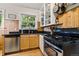 Efficient kitchen with stainless steel appliances and light wood cabinets at 1602 Garfield St, Denver, CO 80206