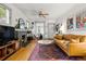 Bright living room featuring a fireplace, hardwood floors, and modern decor at 1602 Garfield St, Denver, CO 80206