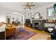 Open-concept living space with hardwood floors, fireplace, and great natural light at 1602 Garfield St, Denver, CO 80206