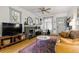 Cozy living room features a stone fireplace, modern furniture, and plenty of natural light at 1602 Garfield St, Denver, CO 80206
