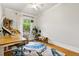 Office with hardwood floors, large window, and comfortable work space at 1602 Garfield St, Denver, CO 80206