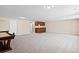 Spacious finished basement with wet bar and carpet flooring at 10610 E 167Th Pl, Brighton, CO 80602