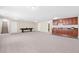 Finished basement featuring a wet bar and ample living space at 10610 E 167Th Pl, Brighton, CO 80602