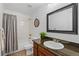 Clean bathroom with granite countertop and tub shower combo at 10610 E 167Th Pl, Brighton, CO 80602