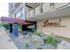 Modern condo building entrance with manicured landscaping and clear signage at 800 N Washington St # 508, Denver, CO 80203