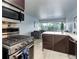 Bright, modern kitchen with a gas range and eat in quartz counters, seamlessly connected to the living space at 800 N Washington St # 508, Denver, CO 80203