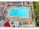 Aerial view of sparkling community pool with lounge chairs and greenery at 800 N Washington St # 508, Denver, CO 80203