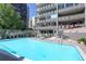 Inviting swimming pool with lounge chairs and shade trees near building at 800 N Washington St # 508, Denver, CO 80203