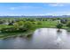Picturesque aerial shot of a tranquil lake with lush green surroundings, creating a serene and scenic landscape at 310 Jay St, Lakewood, CO 80226