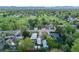 Residential neighborhood with well-kept lawns, mature trees, and multiple homes, offering a glimpse into the community at 310 Jay St, Lakewood, CO 80226