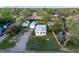 Charming home with a well-maintained lawn, detached garage, and mature trees, creating a welcoming and serene atmosphere at 310 Jay St, Lakewood, CO 80226