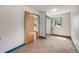 Bright bedroom with a closet featuring a sliding door and a window overlooking the yard at 310 Jay St, Lakewood, CO 80226