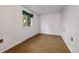 Cozy bedroom with neutral carpet and a window view at 310 Jay St, Lakewood, CO 80226
