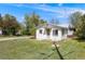 Charming single-story home featuring a well-manicured lawn and inviting entrance at 310 Jay St, Lakewood, CO 80226