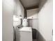 Laundry room with washer, dryer, water heater and overhead storage at 310 Jay St, Lakewood, CO 80226