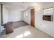 Bright and airy living area with a rustic heater and linoleum flooring at 310 Jay St, Lakewood, CO 80226