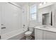 Bright bathroom featuring a shower/tub combination, white vanity and finishes at 1222 Penner Dr, Erie, CO 80026