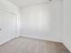 This bedroom features neutral carpet, bright white walls, and a closet at 1222 Penner Dr, Erie, CO 80026
