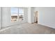 Bright bedroom with large windows and neutral carpet at 1222 Penner Dr, Erie, CO 80026