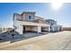 New construction townhome with a two-car garage and neutral exterior at 1222 Penner Dr, Erie, CO 80026