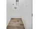 Small laundry room featuring modern wood-look vinyl flooring and washer/dryer hookups at 1222 Penner Dr, Erie, CO 80026