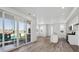Open-concept layout with a kitchen featuring a quartz island and stainless appliances in the foreground at 1222 Penner Dr, Erie, CO 80026